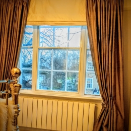 Silk curtains & brass pole